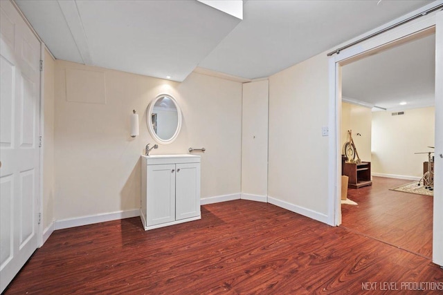 interior space featuring dark hardwood / wood-style flooring and sink