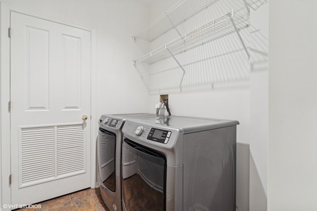 laundry area with separate washer and dryer