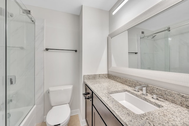 full bathroom featuring vanity, combined bath / shower with glass door, and toilet