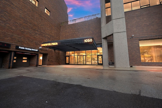 view of outdoor building at dusk