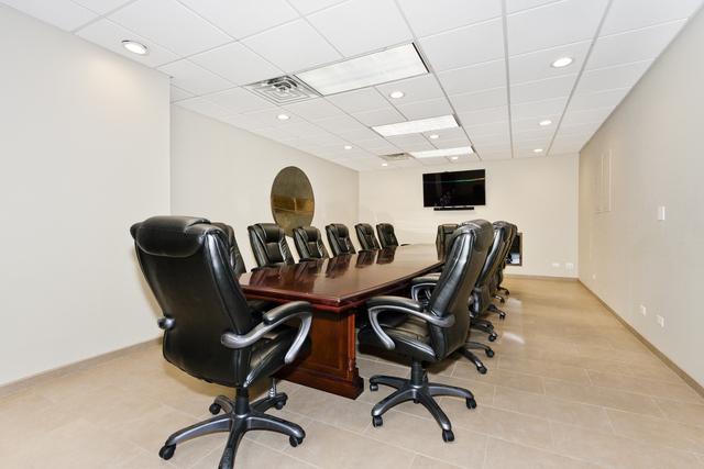 home office with a paneled ceiling