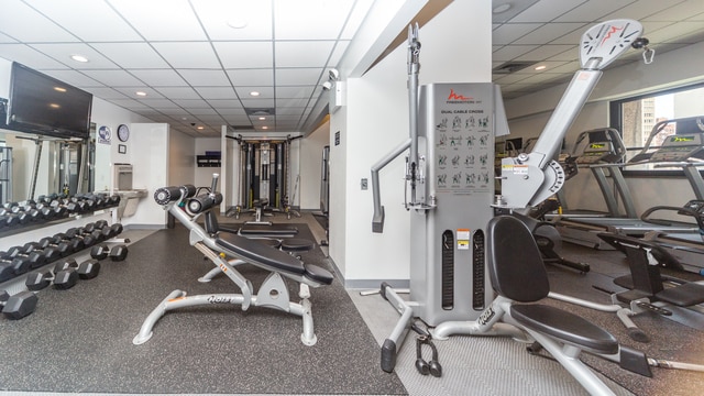 workout area featuring a paneled ceiling