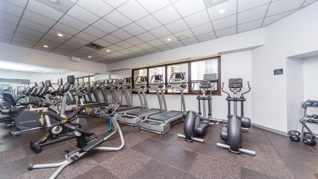 exercise room featuring a paneled ceiling