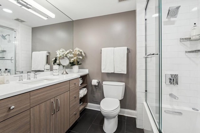 full bathroom featuring tile patterned flooring, enclosed tub / shower combo, vanity, and toilet