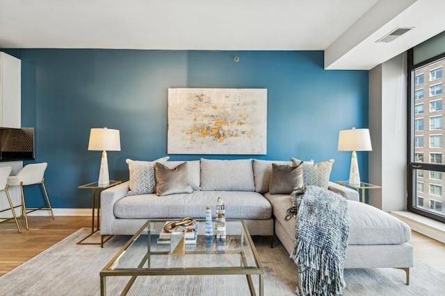 living room with light hardwood / wood-style flooring