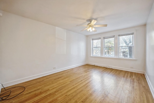 unfurnished room with ceiling fan and light wood-type flooring