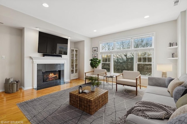 living room featuring hardwood / wood-style floors and a fireplace