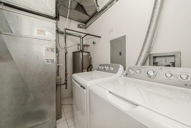 laundry area featuring electric panel, heating unit, gas water heater, washer and dryer, and tile patterned floors