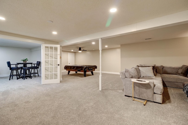 playroom featuring french doors, billiards, carpet, and a textured ceiling