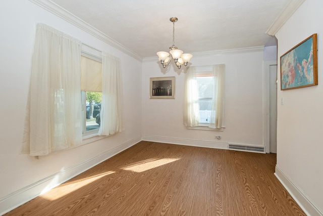 unfurnished dining area with dark wood-type flooring, ornamental molding, and a healthy amount of sunlight