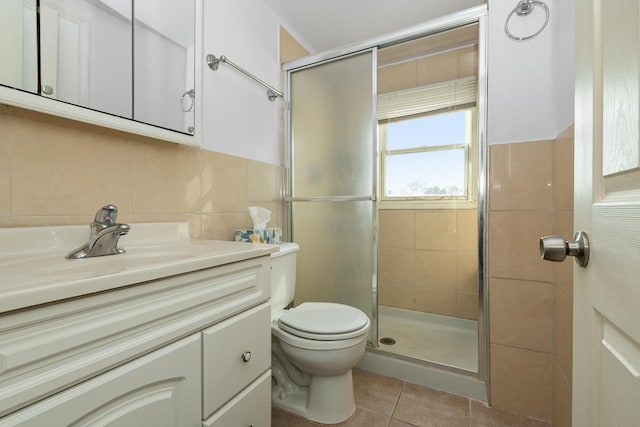 bathroom featuring vanity, tile walls, tile patterned floors, and walk in shower