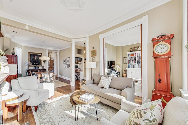 living room with crown molding and wood-type flooring