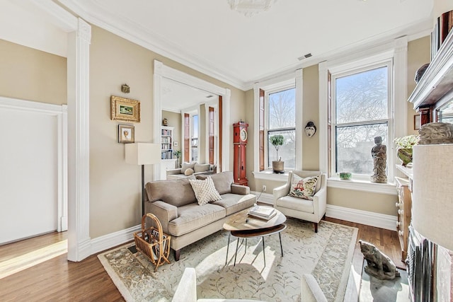 interior space featuring hardwood / wood-style floors and crown molding