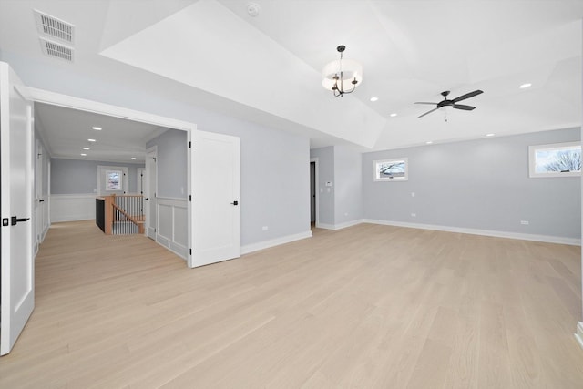 spare room with ceiling fan, light hardwood / wood-style flooring, and a healthy amount of sunlight