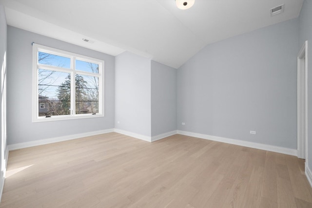 interior space with vaulted ceiling and light wood-type flooring