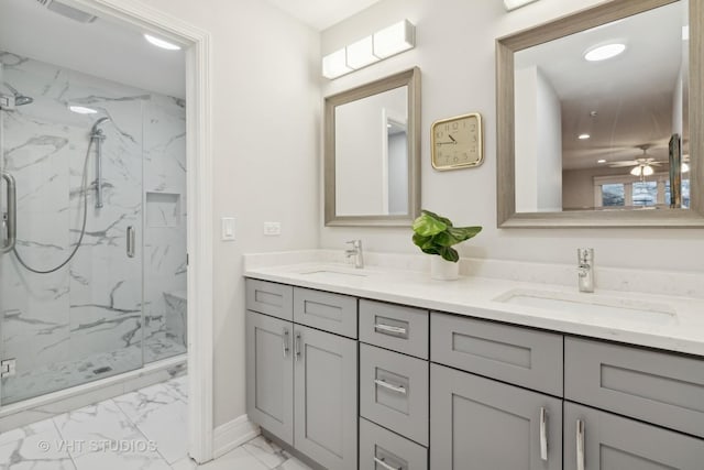 bathroom featuring visible vents, marble finish floor, a sink, and a marble finish shower