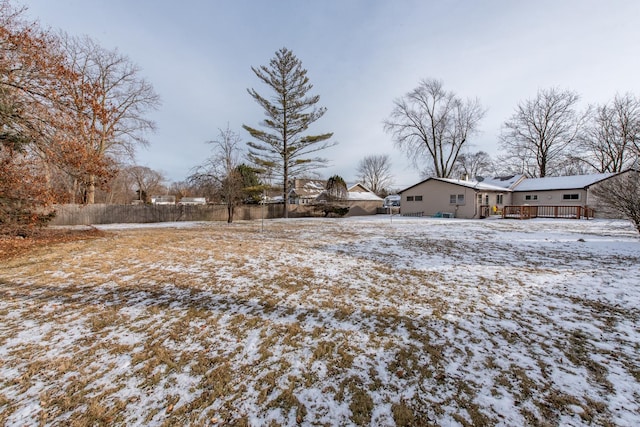 view of yard layered in snow