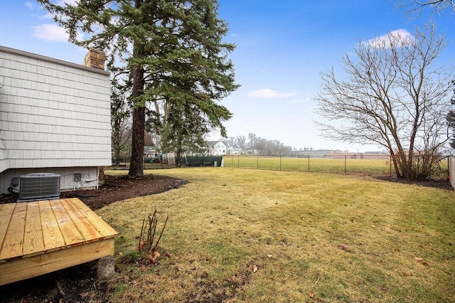 view of yard with a rural view and central air condition unit