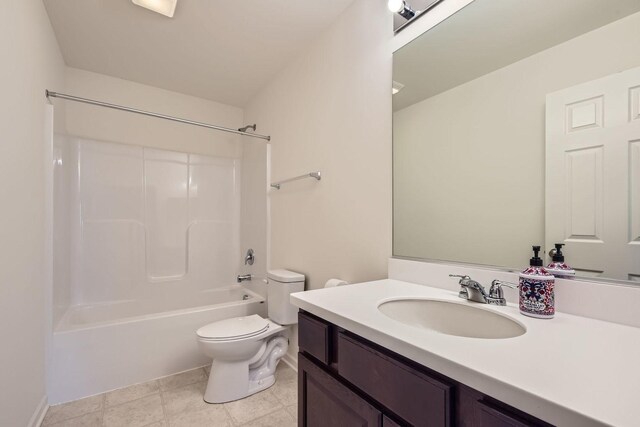 full bathroom featuring washtub / shower combination, vanity, and toilet