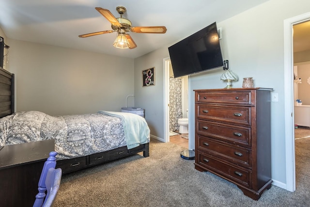 carpeted bedroom with connected bathroom and ceiling fan