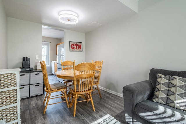 dining space with dark wood-type flooring