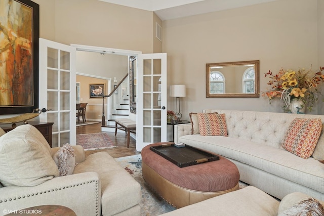 living room with hardwood / wood-style floors and french doors