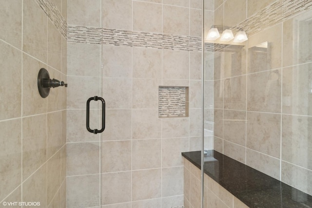 bathroom featuring an enclosed shower