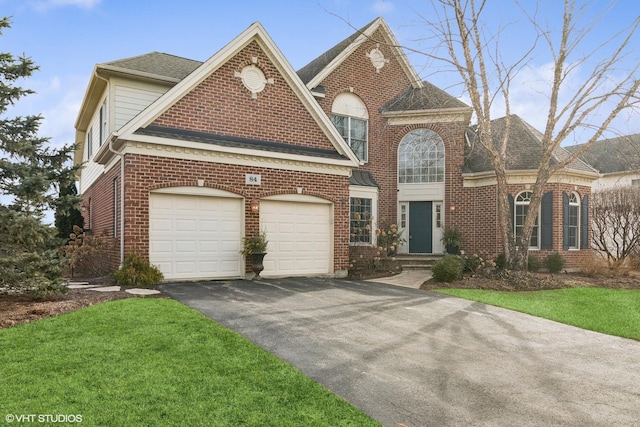 front of property featuring a garage and a front yard