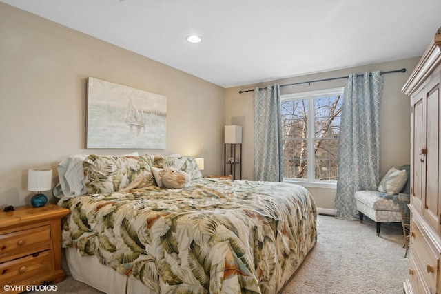 bedroom featuring light colored carpet