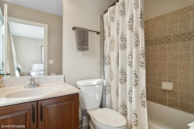 full bathroom with vanity, toilet, and shower / bath combo with shower curtain