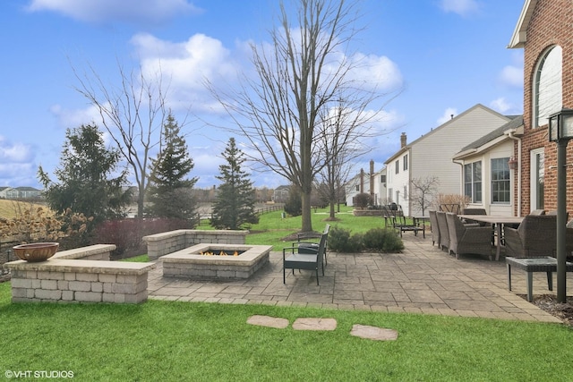 view of yard with a patio and a fire pit