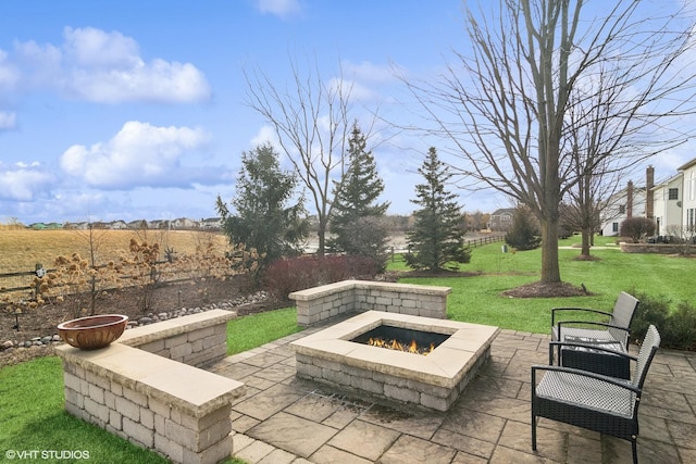 view of patio featuring an outdoor fire pit