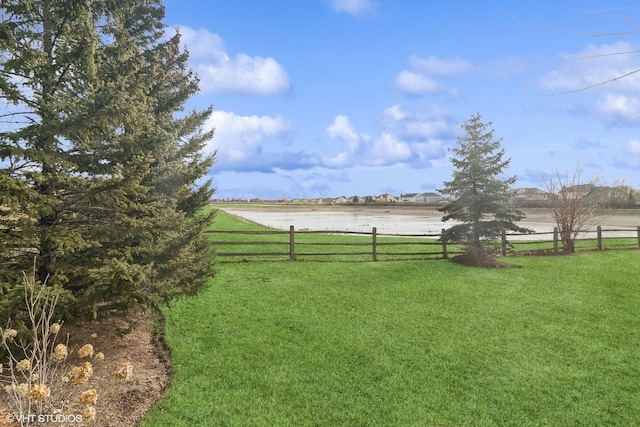 view of yard featuring a water view and a rural view