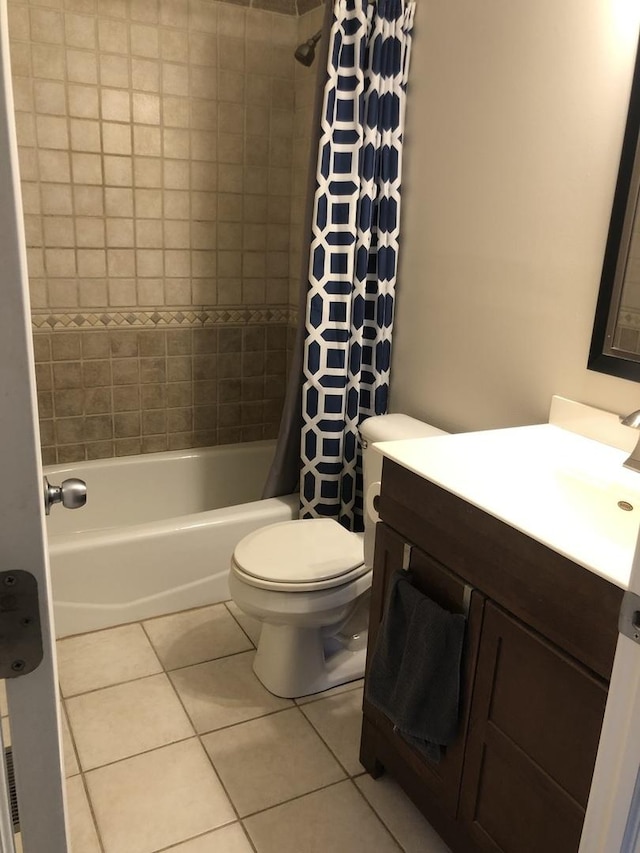 full bathroom with toilet, vanity, shower / bathtub combination with curtain, and tile patterned flooring