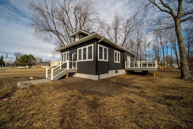 view of side of home featuring a deck