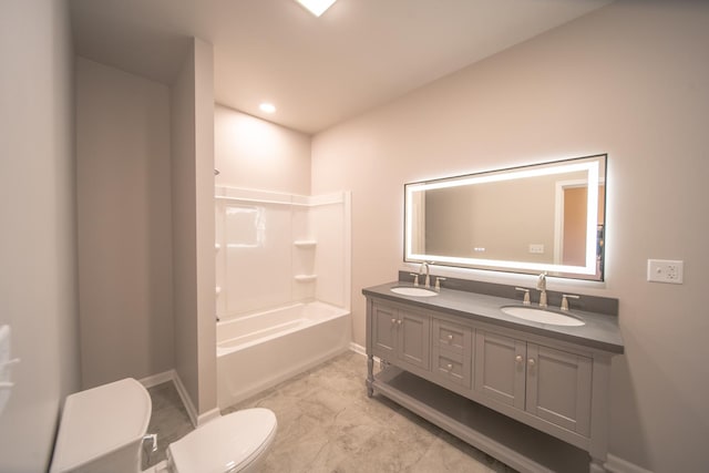 full bathroom with bathtub / shower combination, vanity, and toilet