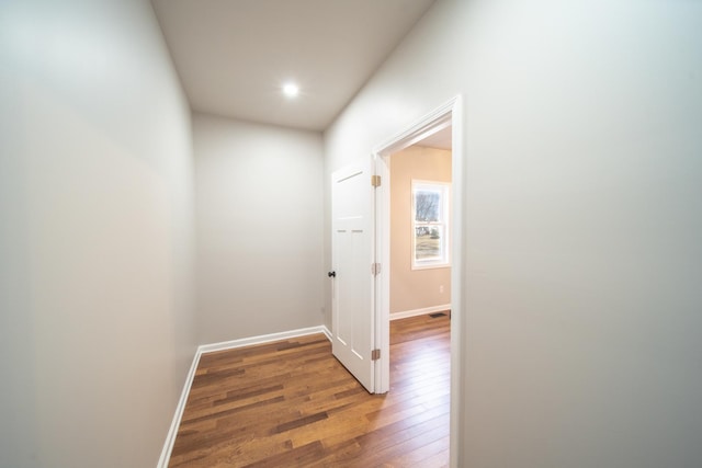 corridor featuring hardwood / wood-style flooring