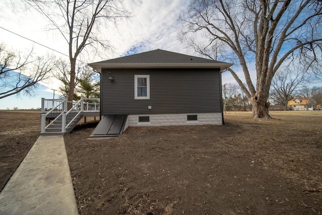 back of house featuring a wooden deck