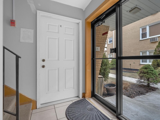 doorway to outside featuring light tile patterned floors