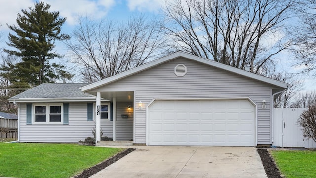 ranch-style home with a garage and a front yard