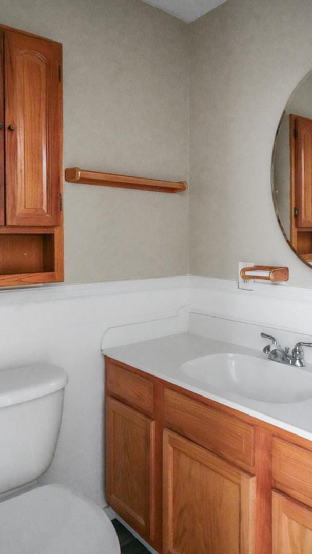 bathroom with vanity and toilet