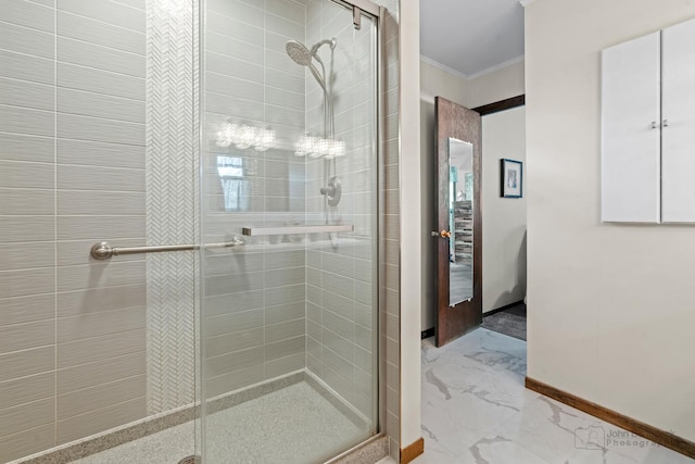 bathroom with walk in shower and ornamental molding