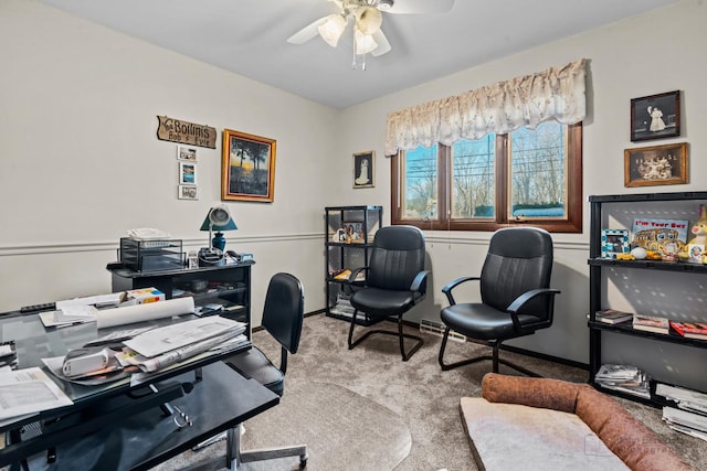 carpeted office with ceiling fan