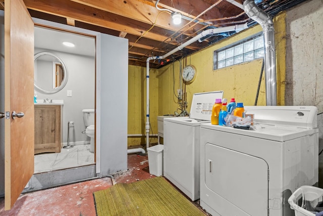 laundry area with sink and washer and dryer