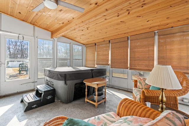 sunroom / solarium with wood ceiling, ceiling fan, lofted ceiling with beams, and a wealth of natural light