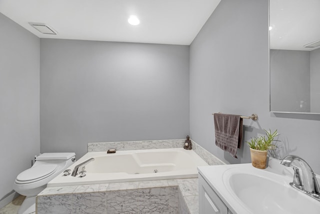 bathroom with toilet, sink, and tiled tub