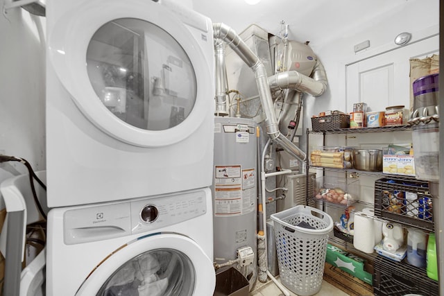 laundry room featuring stacked washer / drying machine and gas water heater