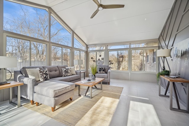 sunroom with ceiling fan and lofted ceiling