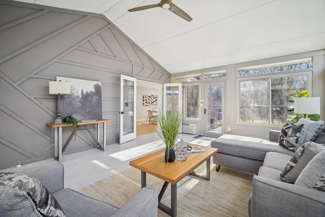 sunroom featuring ceiling fan, vaulted ceiling, and a wall unit AC