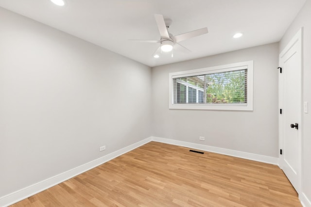 unfurnished room featuring light hardwood / wood-style flooring and ceiling fan